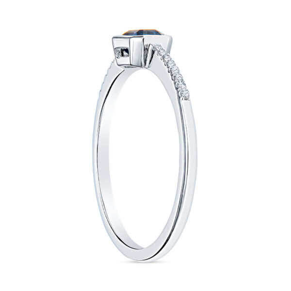 a white gold engagement ring with an oval shaped diamond