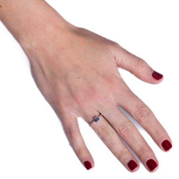 a woman's hand with a ring on it