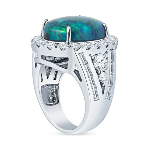 a white gold ring with a black opal and diamonds
