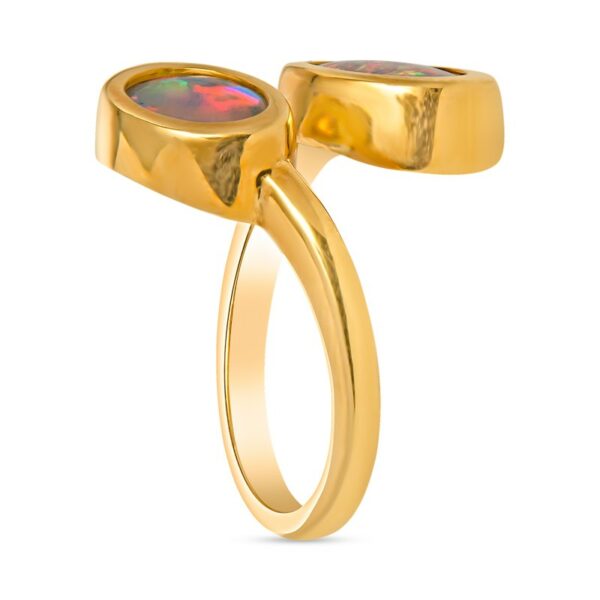 a gold ring with an opal stone in the center