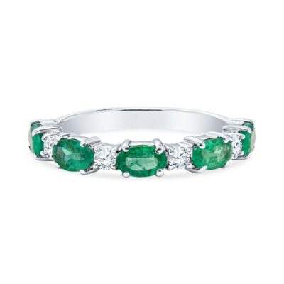 three stone emerald and diamond ring in white gold