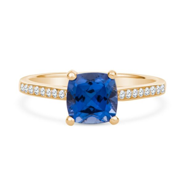 a gold ring with a blue sapphire and diamonds