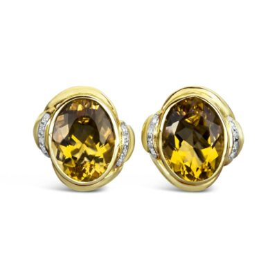 a pair of yellow sapphire and diamond earrings