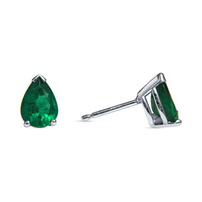 a pair of earrings with an emerald stone