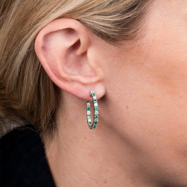 a close up of a person wearing earrings