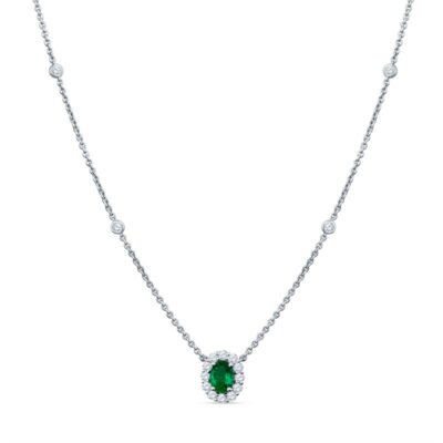 a necklace with a green stone on it