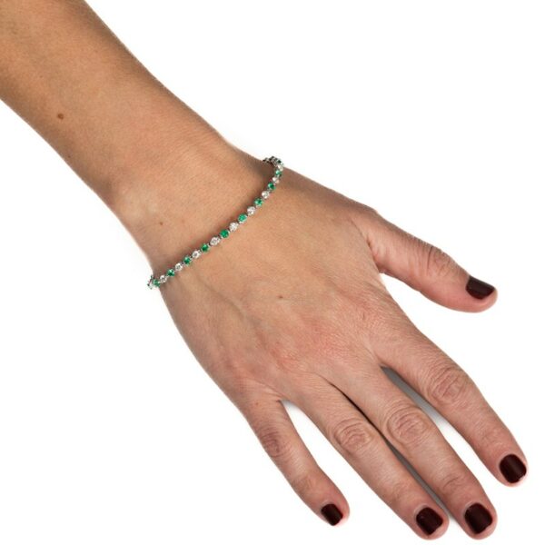 a woman's hand with a bracelet on it