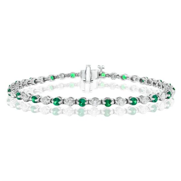 a bracelet with green and white beads