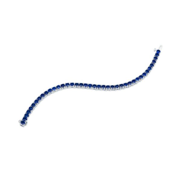 a long blue beaded necklace on a white background