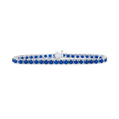 a blue sapphire tennis bracelet on a white background