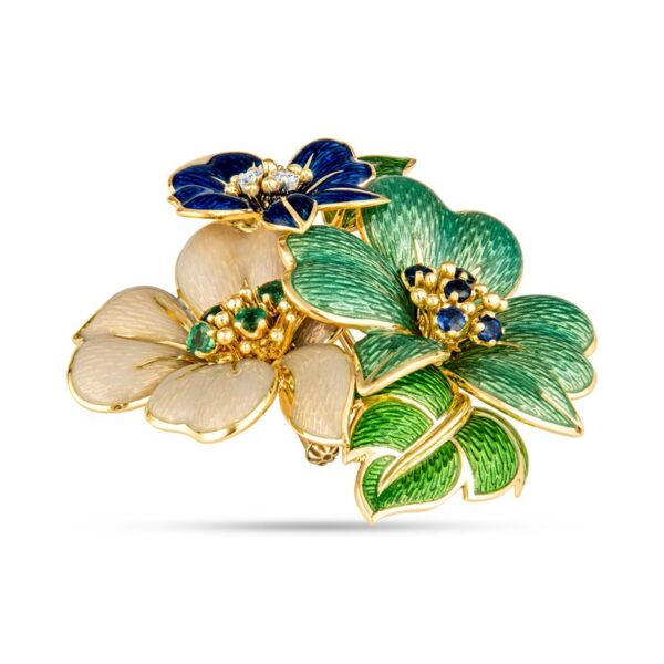 a brooch with flowers and leaves on it