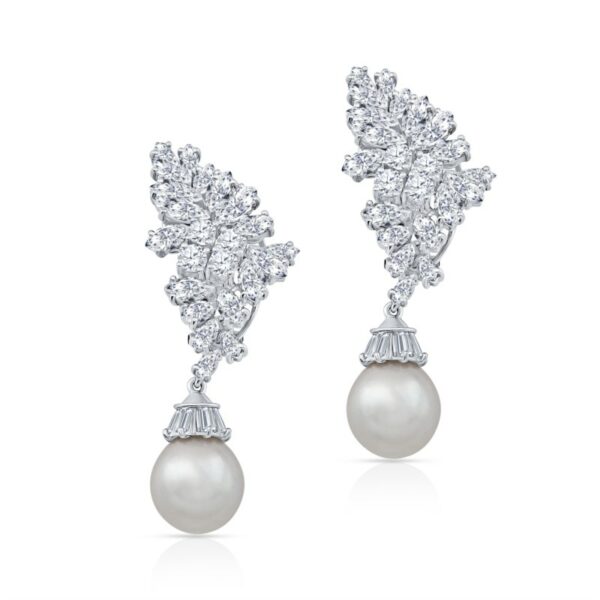 a pair of white pearls and diamond earrings