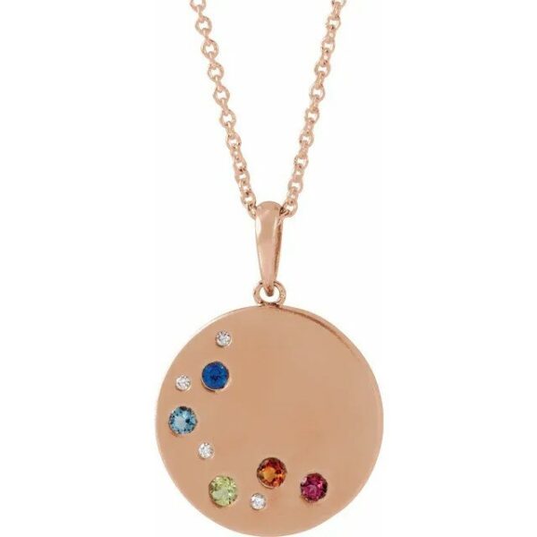 a gold necklace with four different colored stones