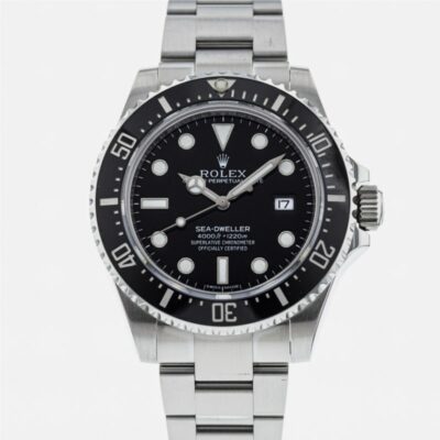 a rolex watch with a black dial