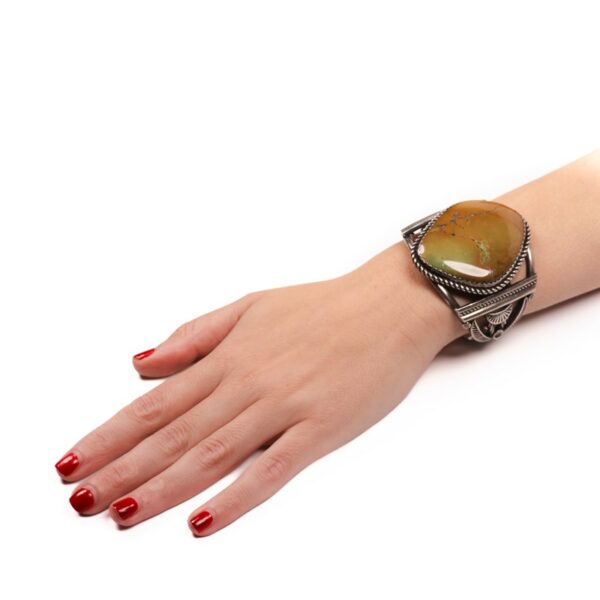a woman's arm with a ring on it