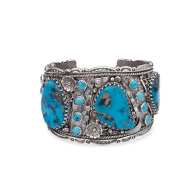 a bracelet with turquoise stones on it