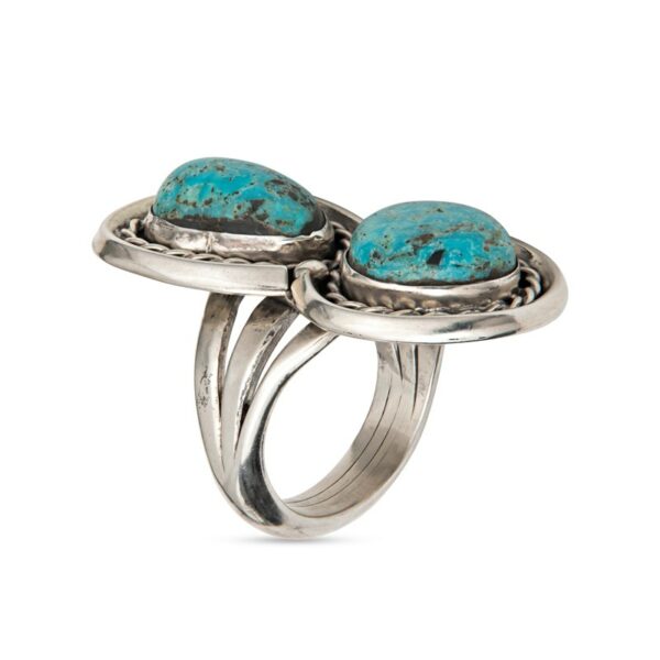two turquoise stone rings on top of each other