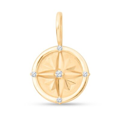 a yellow gold compass charm with diamonds