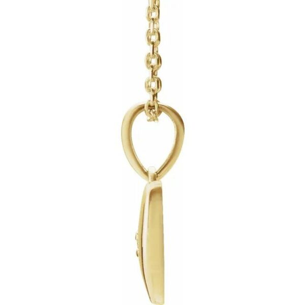 a gold chain with a heart and a pair of scissors hanging from it