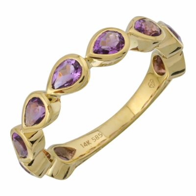 a yellow gold ring with purple stones