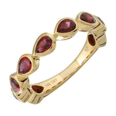 a yellow gold ring with red stones