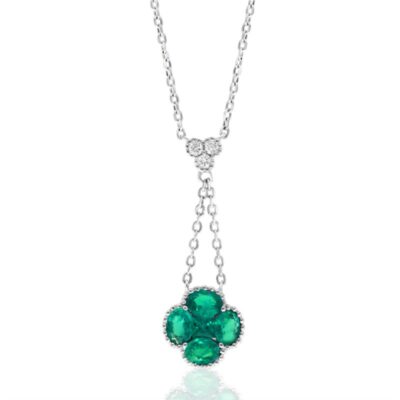 a necklace with green stones hanging from it