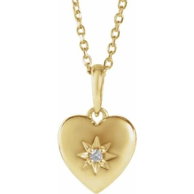 a heart shaped pendant with a star on it