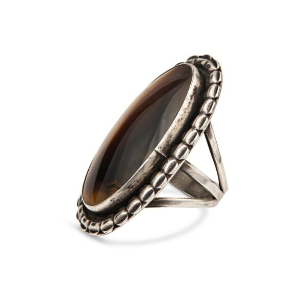 a ring with a brown stone in it