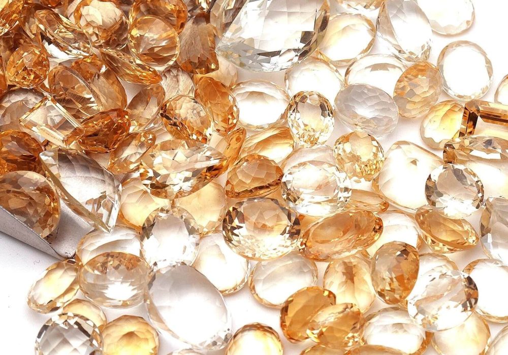 a pile of yellow and white glass beads