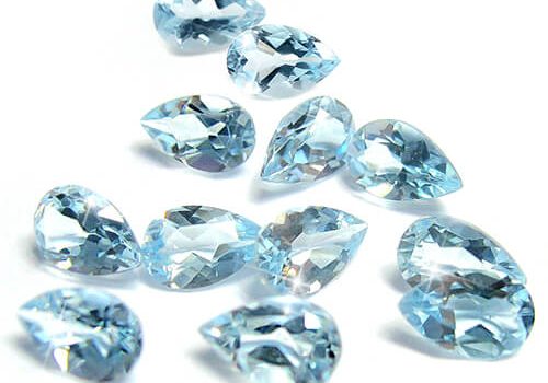 a group of blue diamonds on a white surface